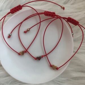 3 red adjustable string bracelets with dainty heart beads
